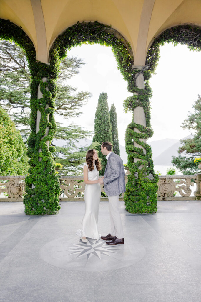 Marriage proposal under ivy arch at Villa del Balbianello