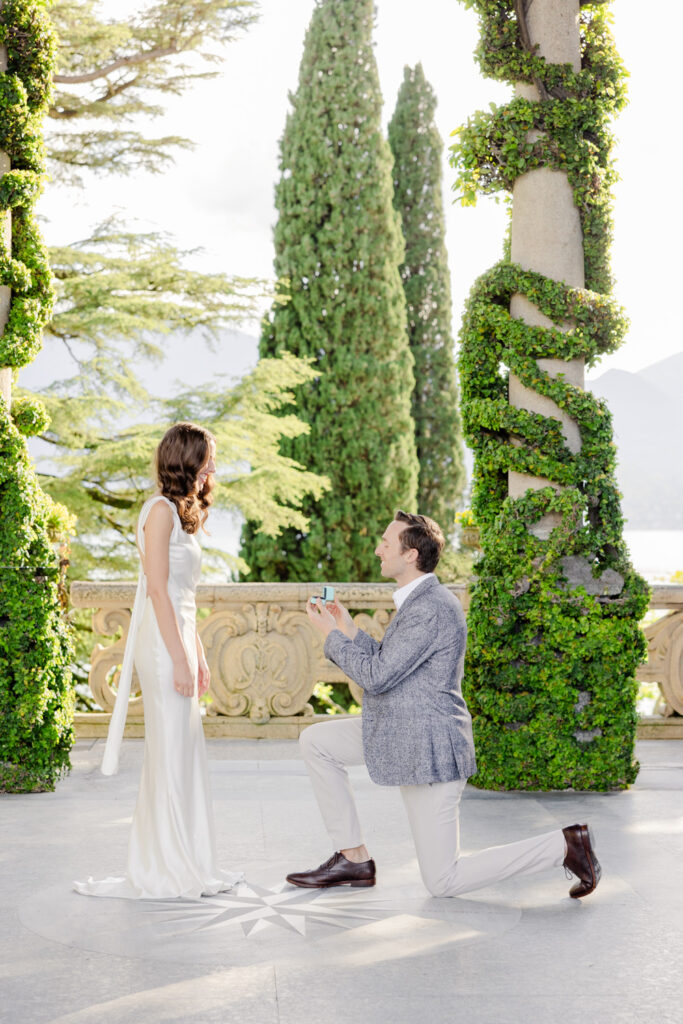 Marriage proposal under ivy arch at Villa del Balbianello